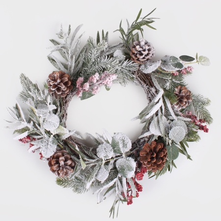 Snow-covered wreath with cones